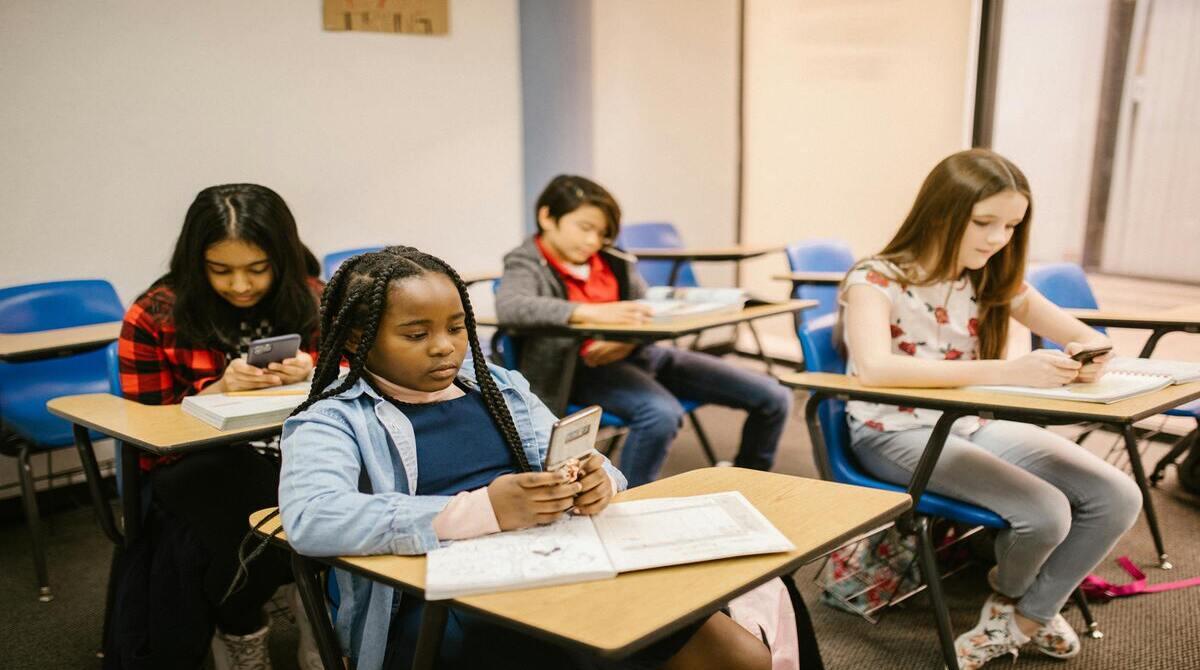 Banning cell phone use by students in K-12 schools during normal school hours is beneficial.
